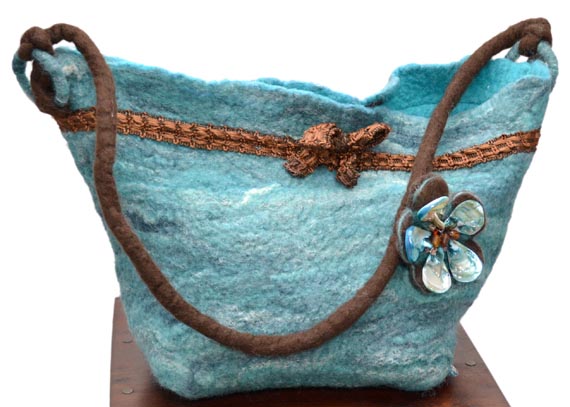 Merino and felt teal handbag with pearl shell brooch